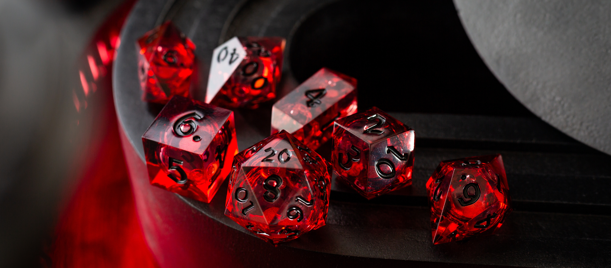 Liquid core DnD dice featuring swirling liquid-filled interiors, offering dynamic and unique rolling action